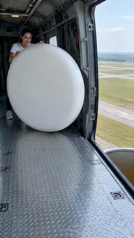 Giant mint candy rolled out of a helicopter into a giant cola can — 15-second vertical stunt video