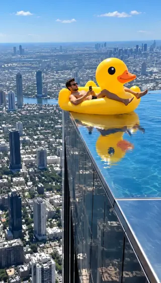 A duck float at a rooftop pool edge preview